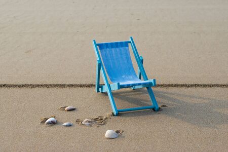 Deck chair on the sandy beachの写真素材