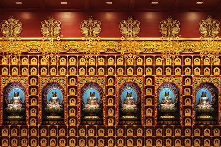 The statue of Buddha, Chinese Buddha Tooth Relic. Design patterns in the wall. Side of the corridor.