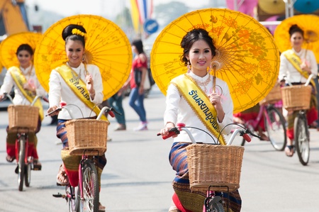 CHIANG MAI, THAILAND-JANUARY 18 : 30th anniversary Bosang umbrella festival,Woman in traditional costume during the annual Umbrella festival at San Kamphaeng. on Jan.18, 2013 in Chiang Mai, Thailand.のeditorial素材