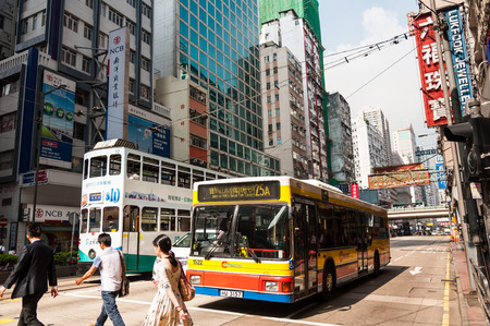 HONG KONG , CHINA - JULY 8   Transportation system of Hong Kong with the electric trams  Private car and bus  on July 8,2014 in Hong Kong のeditorial素材