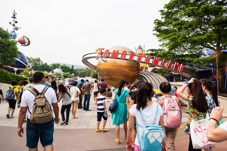 DISNEYLAND , HONG KONG - JULY 8 : Tourists unite the family a walking tour and the playing fun park....