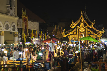 CHIANG MAI THAILAND - MARCH 8 : Sunday market walking street, The city center Thai temple marketing and trading of local tourists come to buy as souvenirs. on March 8 , 2015 in Chiang Mai, Thailand.のeditorial素材
