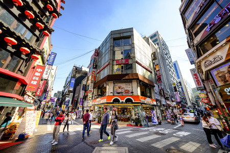 SEOUL, KOREA - OCTOBER 3, 2015 : Myeong-Dong shopping street, Korean people tourists walking shopping the neighbourhood. It is fashionable to be the most popular. neighbourhood is must when traveling.のeditorial素材