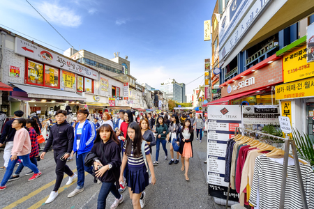 SEOUL, KOREA - OCTOBER 4, 2015 : Hongdae shopping street, Korean people tourists walking shopping the neighbourhood. It is fashionable to be the most popular. neighbourhood is must when traveling.のeditorial素材