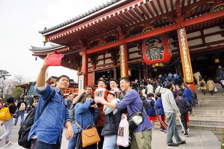 TOKYO JAPAN-MAR.27,2018 : Sensoji temple at Asakusa neighborhood, tourists come to pay homage to buddha & pray. This temple is a place of pristine beauty, architectural treasures are unique to Japan. One of Tokyoa's must-see places to visit.のeditorial素材
