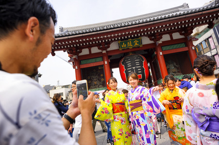 TOKYO JAPAN - MAR.27,2018 : Sensoji temple at Asakusa neighborhood, Tourists wearing beautiful kimono walks inside the temple & Nakamise shopping. One of Tokyo's must-see places to visit.