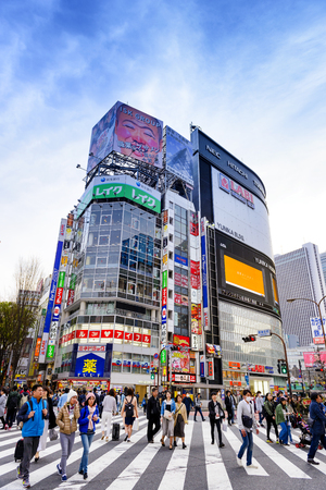 TOKYO JAPAN - APRIL 1, 2018 : Shinjuku neighborhood, Unidentified young tourists walk past this area has many shops full to shopping and restaurants. One of Tokyo's must-see places to visit.のeditorial素材