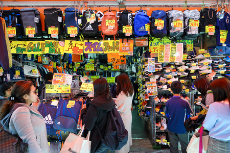 TOKYO JAPAN - MARCH 30, 2018 : Ameyoko market neighborhood, Unidentified tourists walk past this area has many shops full to shopping and restaurants. One of Tokyo's must-see places to visit.のeditorial素材