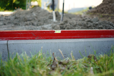 Level on the concrete kerb. Leveling on the construction site. work zone. measurement.