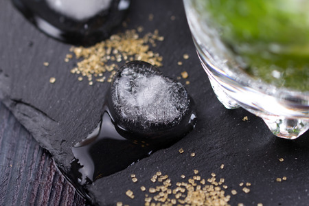 mojito with a lime on a table