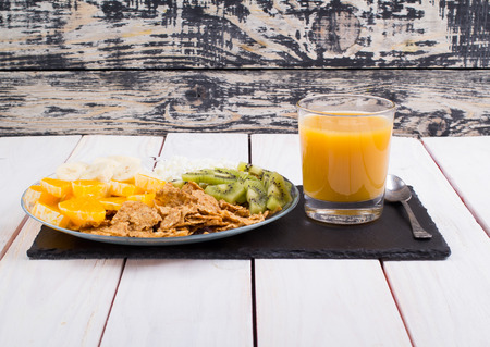 Kiwi fruit, banana, cottage cheese, healthy food on a table