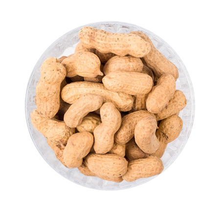 Peanut in a shell in a bowl isolated