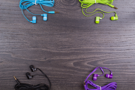 Earphones color on office tableの写真素材