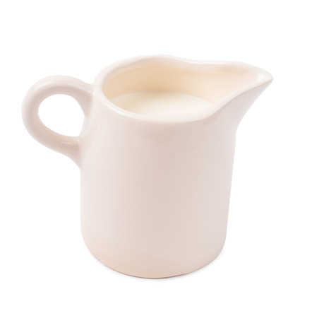 Milk in a white jug isolateの写真素材