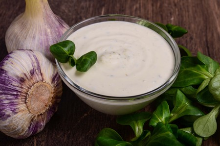 Homemade sauce on a dark wood tableの写真素材