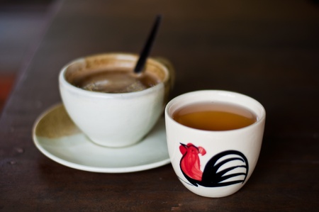 a cup of tea with a cup of coffeeの写真素材
