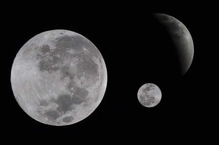 the moons on dark backgroundの写真素材