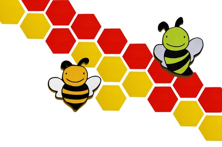 a small wooden bee on white background の写真素材