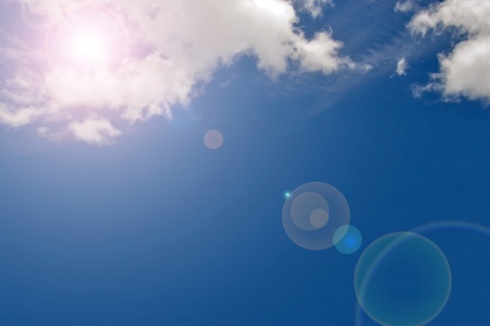 artificial lens flare on blue sky background ,synthetic of lens flare on sky background  の写真素材