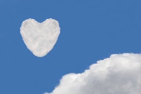 heart cloud shape on blue skyの写真素材