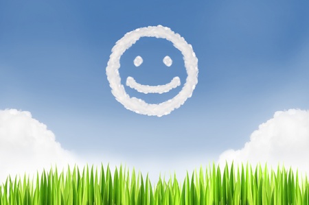 Green grass and smile cloud with blue sky background  in a nice  dayの写真素材