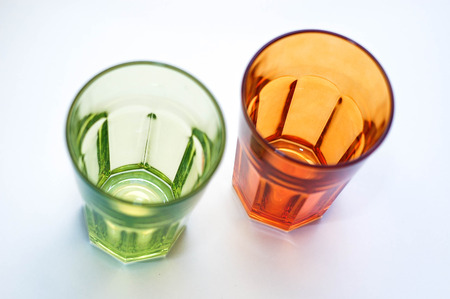Colourful drinking glasses on white backgroundの写真素材