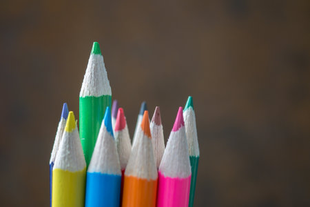 Colorful pencils on wooden background. Back to school concept.の写真素材