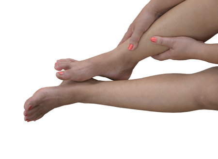 Close up of female feet on white background. Isolated image.の写真素材