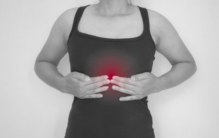 Woman suffering from pain in the lower back. Health care concept.の写真素材