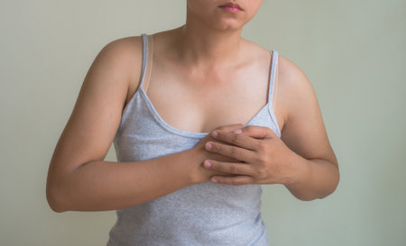 Woman suffering from chest pain. Health care, medical and diet concept.の写真素材