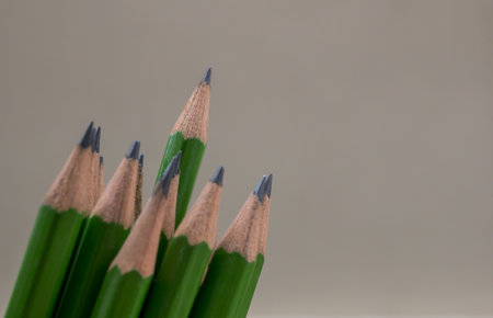 Green pencils on a grey background. Shallow depth of field.の写真素材