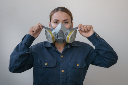 Woman wearing a gas mask to protect against the spread of the virusの写真素材