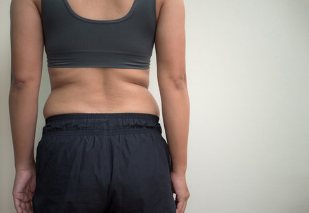 woman in sportswear on white background. Weight loss concept.