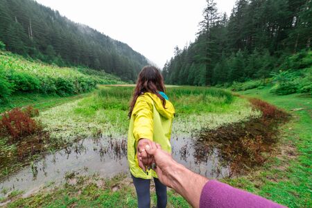 Kullu, Himachal Pradesh, India - September 02, 2018 : Follow me. Travel concept. Back view of young...