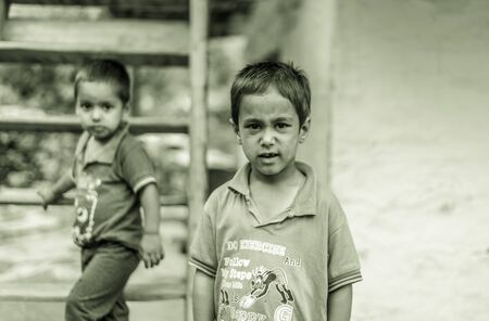 Kullu, Himachal Pradesh, India - August 06, 2018 : Photo of himachali children near their house, on the street in Himalayan village, Sainjのeditorial素材
