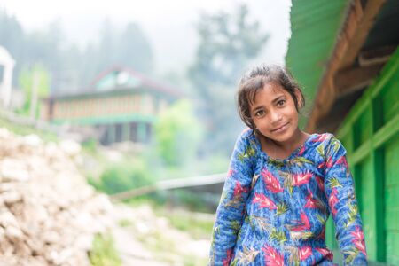 Kullu, Himachal Pradesh, India - August 31, 2018 : Portrait of himachali girl near her house in himalayas, Indiaのeditorial素材