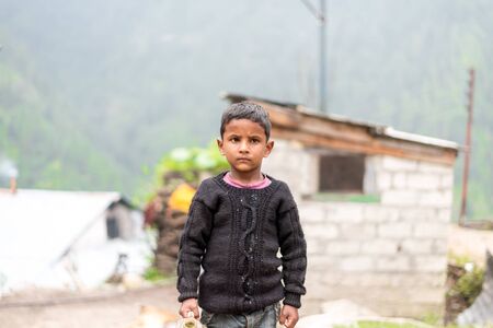 Kullu, Himachal Pradesh, India - August 31, 2018 : Portrait of himachali boy near his house in himalayasのeditorial素材