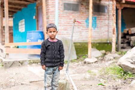 Kullu, Himachal Pradesh, India - August 31, 2018 : Portrait of himachali boy near his house in himalayasのeditorial素材