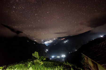 Amazing scene with himalayan mountains and starry sky in sainjの写真素材