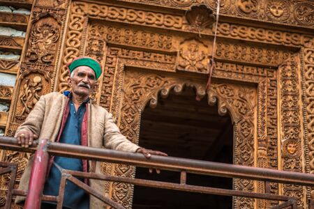 Kullu, Himachal Pradesh, India - September 01, 2018 : Photo of himachali old man at temple on the street in Himalayan village, Indiaのeditorial素材