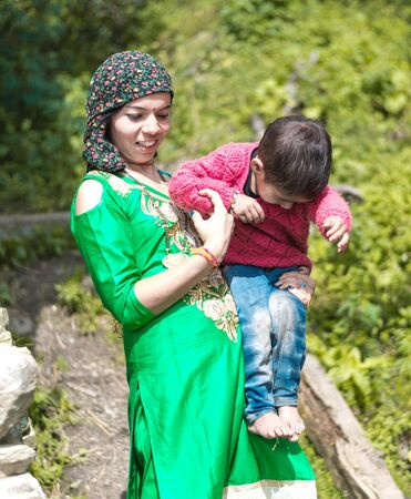 Kullu, Himachal Pradesh, India - September 01, 2018 : Portrait himachali mother and child on the street in Himalayan village, Indiaのeditorial素材