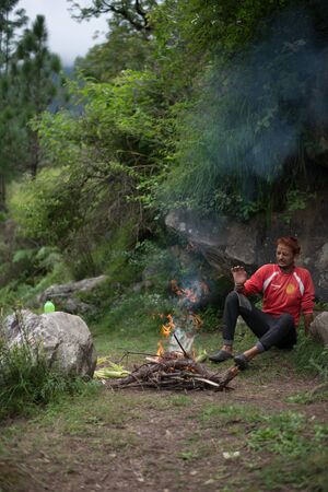 Kullu, Himachal Pradesh, India - September 03, 2018 : Grilling Corn on Bonfire in Himalayas, Indiaのeditorial素材