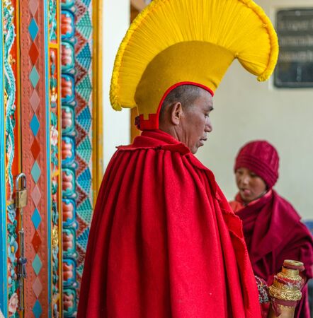 Spiti, Himachal Pradesh, India - March 24, 2019 : Photo of lama wearing dress for mask dance in himalayas -のeditorial素材