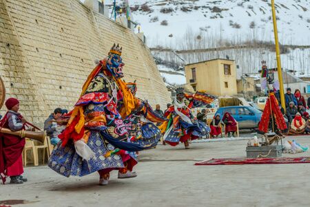 Spiti, Himachal Pradesh, India - March 24, 2019 : Tibetan buddhist lamas dressed in mystical mask dance Tsam mystery in time of festival in himalayasのeditorial素材