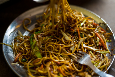 Photo of dry vegetable chow mein noodles served in plate in himalayasの写真素材
