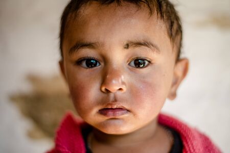 Kullu, Himachal Pradesh, India - April 01, 2019 : Portrait of Himalayan boy, Kid in himalayas in indiaのeditorial素材