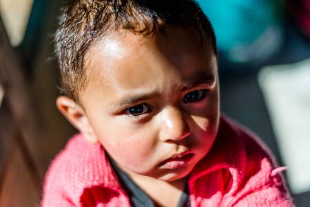 Kullu, Himachal Pradesh, India - April 01, 2019 : Portrait of Himalayan boy, Kid in himalayas in indiaのeditorial素材