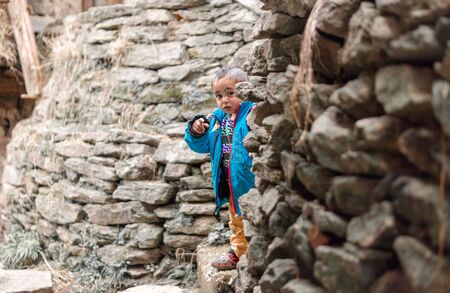 Kullu, Himachal Pradesh, India - April 01, 2019 : Portrait of Himalayan boy, Kid in himalayas in indiaのeditorial素材