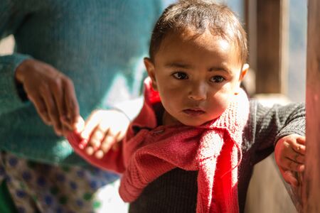 Kullu, Himachal Pradesh, India - April 01, 2019 : Portrait of Himalayan boy, Kid in himalayas in indiaのeditorial素材