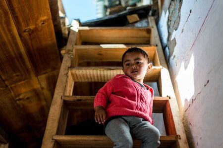 Kullu, Himachal Pradesh, India - April 01, 2019 : Portrait of Himalayan boy, Kid in himalayas in indiaのeditorial素材